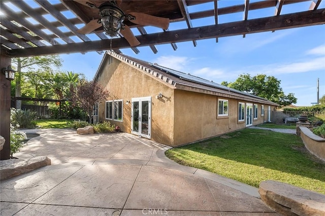 464 Appleby St, Corona, CA 92881 - view of side of property with ceiling fan, solar panels, a pergola, a fenced backyard, and stucco siding