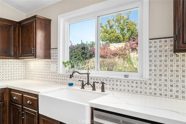 464 Appleby St, Corona, CA 92881 - kitchen with dark brown cabinets, decorative backsplash, and light stone counters