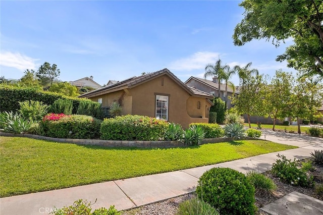 464 Appleby St, Corona, CA 92881 - view of side of property featuring stucco siding and a yard