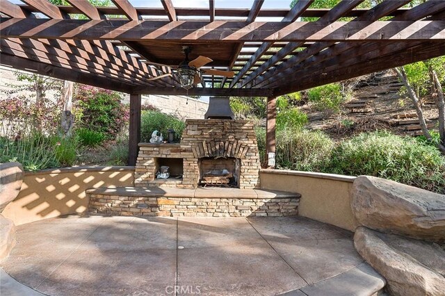 464 Appleby St, Corona, CA 92881 - view of patio featuring an outdoor stone fireplace, a ceiling fan, and a pergola