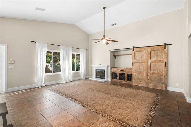 464 Appleby St, Corona, CA 92881 - unfurnished living room with a ceiling fan, a barn door, high vaulted ceiling, a glass covered fireplace, and tile patterned floors