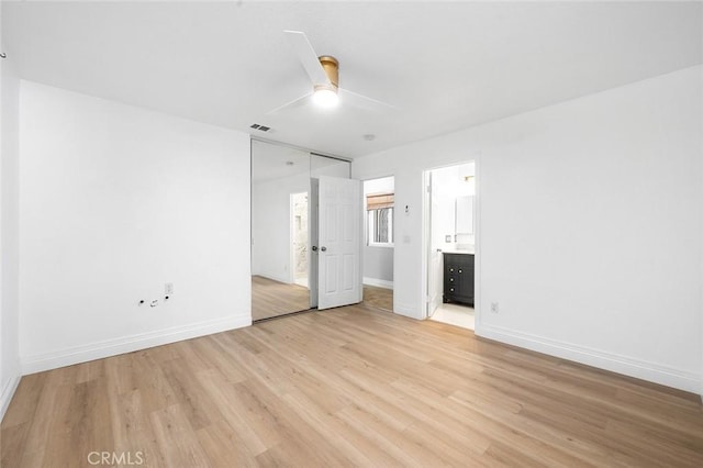 464 Appleby St, Corona, CA 92881 - unfurnished bedroom with light wood-style floors, connected bathroom, and a ceiling fan