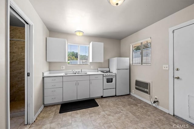 7100 Navajoa Ave, Atascadero, CA 93422 - kitchen featuring white appliances, heating unit, and light countertops