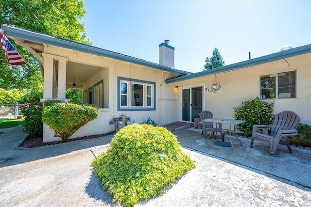 7100 Navajoa Ave, Atascadero, CA 93422 - back of property featuring a chimney, stucco siding, and a patio area
