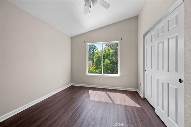 7100 Navajoa Ave, Atascadero, CA 93422 - unfurnished bedroom featuring dark wood-style flooring, lofted ceiling, and a ceiling fan