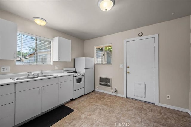 7100 Navajoa Ave, Atascadero, CA 93422 - kitchen featuring white appliances, heating unit, light countertops, and white cabinetry