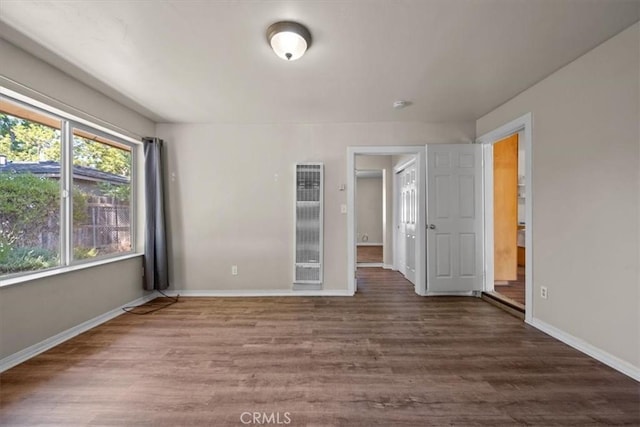 7100 Navajoa Ave, Atascadero, CA 93422 - unfurnished bedroom with a heating unit and wood finished floors