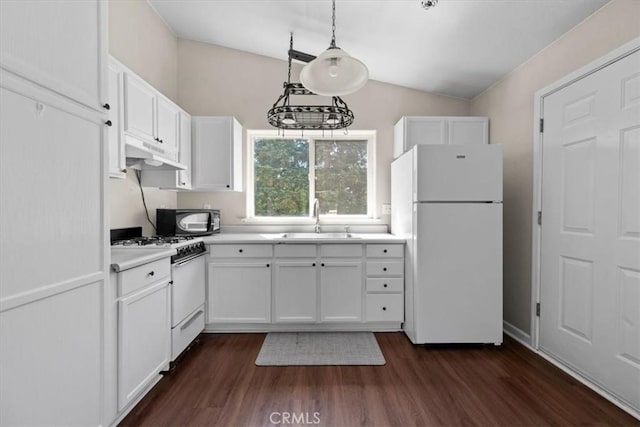 7100 Navajoa Ave, Atascadero, CA 93422 - kitchen featuring white appliances, under cabinet range hood, white cabinets, light countertops, and dark wood finished floors