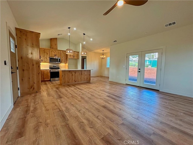 5980 Crestmoor Dr, Paradise, CA 95969 - kitchen featuring appliances with stainless steel finishes, open floor plan, vaulted ceiling, light wood-style floors, and ceiling fan