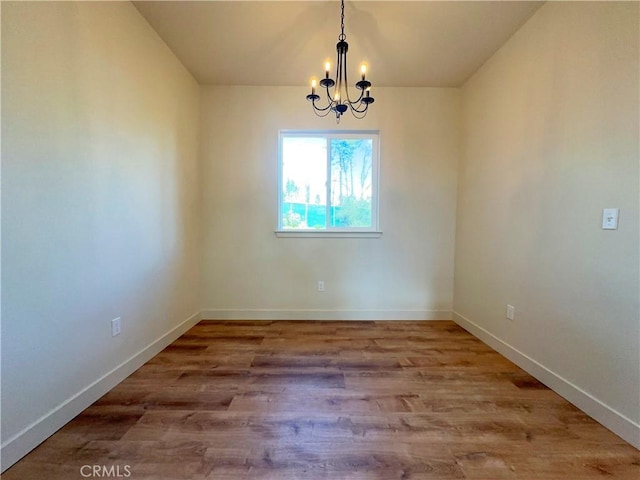 5980 Crestmoor Dr, Paradise, CA 95969 - unfurnished room with a chandelier and wood finished floors