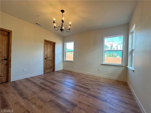 5980 Crestmoor Dr, Paradise, CA 95969 - spare room featuring a chandelier and dark wood finished floors