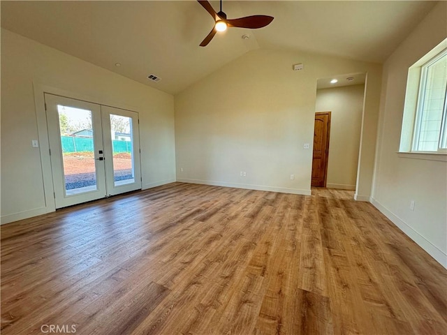 5980 Crestmoor Dr, Paradise, CA 95969 - empty room with lofted ceiling, ceiling fan, plenty of natural light, wood finished floors, and french doors