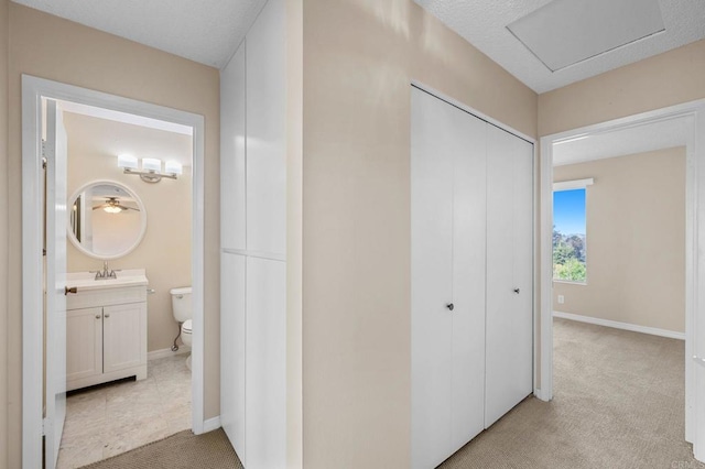 1866 Forestdale Dr, Encinitas, CA 92024 - hallway with light colored carpet and a sink