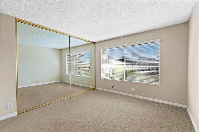 1866 Forestdale Dr, Encinitas, CA 92024 - unfurnished bedroom featuring carpet, a closet, and a textured ceiling