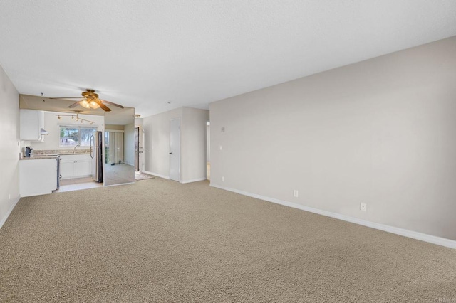 1866 Forestdale Dr, Encinitas, CA 92024 - unfurnished living room featuring light colored carpet and a ceiling fan