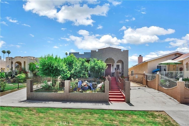 1026 Sentinel Ave, Los Angeles, CA 90063 - mediterranean / spanish-style house with stucco siding and a gate