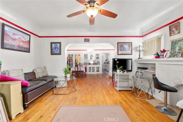 1026 Sentinel Ave, Los Angeles, CA 90063 - living area featuring arched walkways, wood finished floors, and ceiling fan
