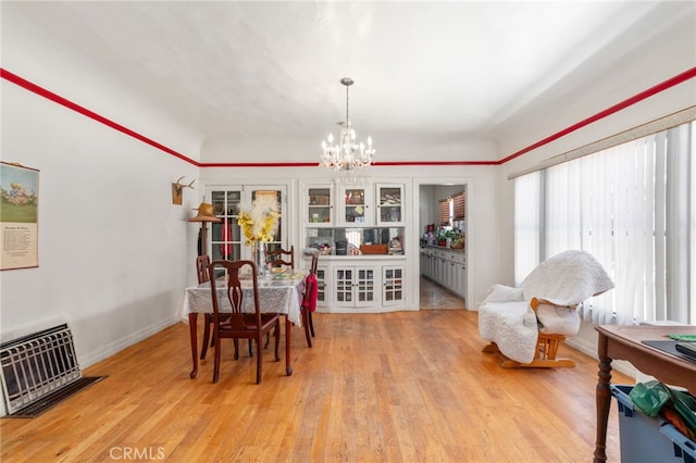 1026 Sentinel Ave, Los Angeles, CA 90063 - dining area featuring a chandelier and light wood-style flooring