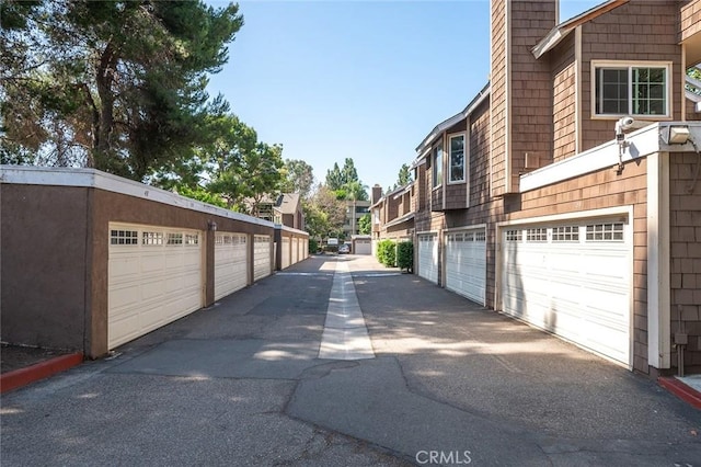 12555 Euclid St Unit 2, Garden Grove, CA 92840 - view of asphalt road featuring community garages and a residential view