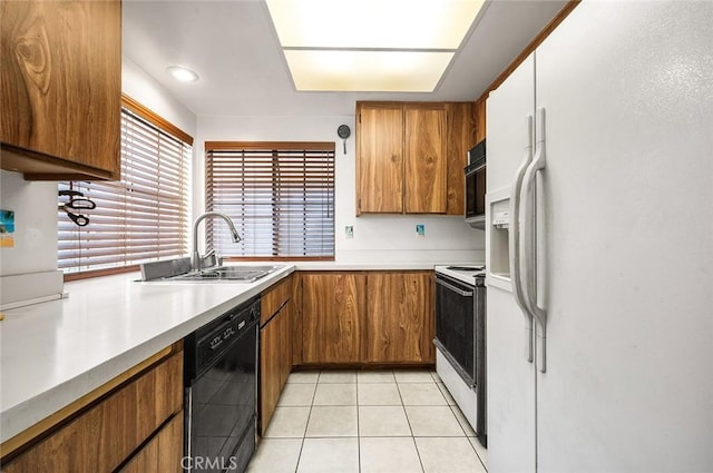 12555 Euclid St Unit 2, Garden Grove, CA 92840 - kitchen featuring white appliances, brown cabinetry, light tile patterned floors, and light countertops