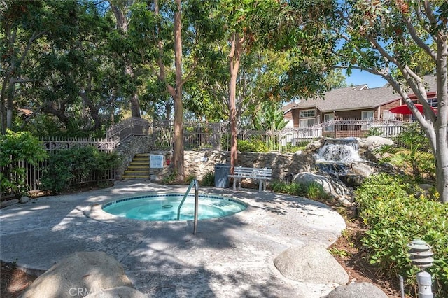 12555 Euclid St Unit 2, Garden Grove, CA 92840 - view of swimming pool with a community hot tub and stairway