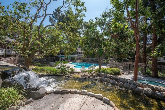 12555 Euclid St Unit 2, Garden Grove, CA 92840 - view of swimming pool with a hot tub