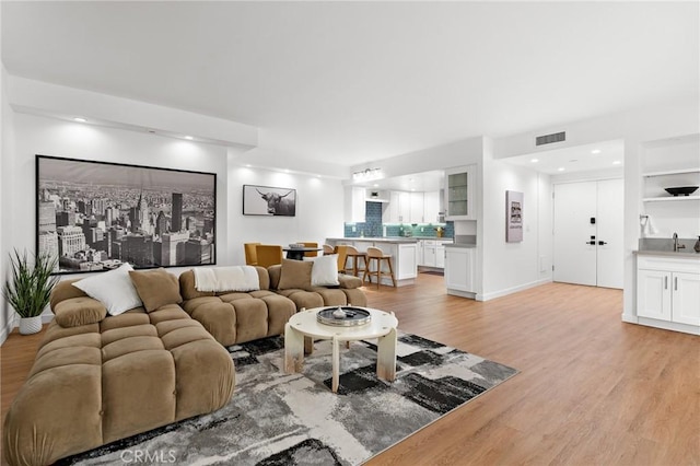 321 S San Vicente Blvd Unit 507, Los Angeles, CA 90048 - living area featuring light wood-style flooring and recessed lighting