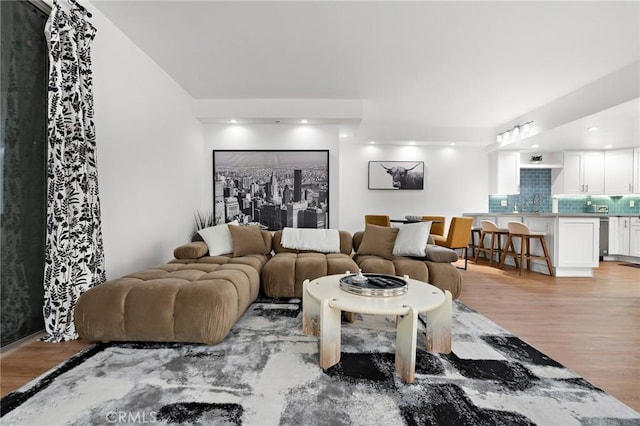 321 S San Vicente Blvd Unit 507, Los Angeles, CA 90048 - living room featuring light wood-style floors and recessed lighting