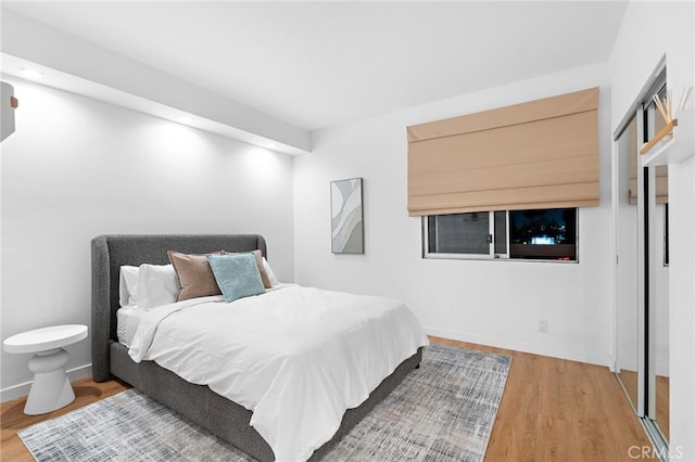 321 S San Vicente Blvd Unit 507, Los Angeles, CA 90048 - bedroom featuring wood finished floors and baseboards
