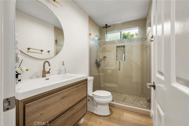 5 Bergamo, Irvine, CA 92614 - bathroom featuring vanity, a shower stall, and wood finished floors