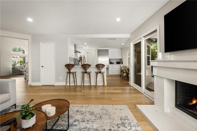 5 Bergamo, Irvine, CA 92614 - living room with a premium fireplace, light wood-type flooring, and recessed lighting