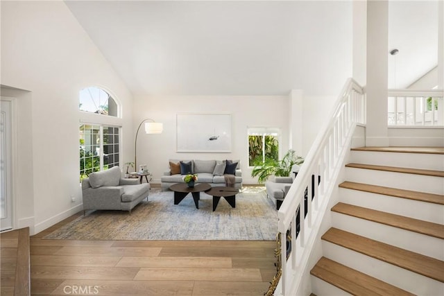 5 Bergamo, Irvine, CA 92614 - living room with high vaulted ceiling, hardwood / wood-style floors, and stairway