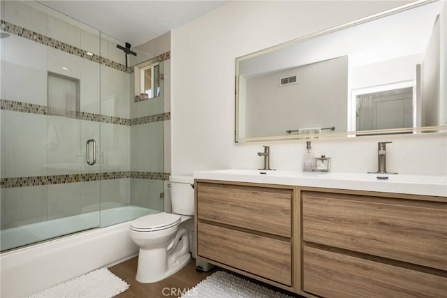 5 Bergamo, Irvine, CA 92614 - bathroom featuring double vanity, combined bath / shower with glass door, and wood finished floors