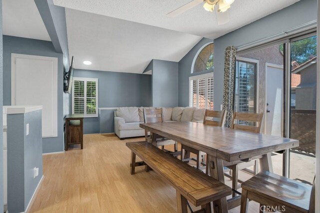 2367 Archwood Ln Unit 171, Simi Valley, CA 93063 - dining area with light wood-style flooring, ceiling fan, vaulted ceiling, healthy amount of natural light, and a textured ceiling