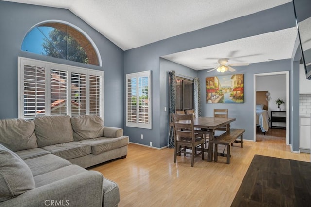 2367 Archwood Ln Unit 171, Simi Valley, CA 93063 - living room featuring vaulted ceiling, light wood-style floors, a ceiling fan, and a textured ceiling