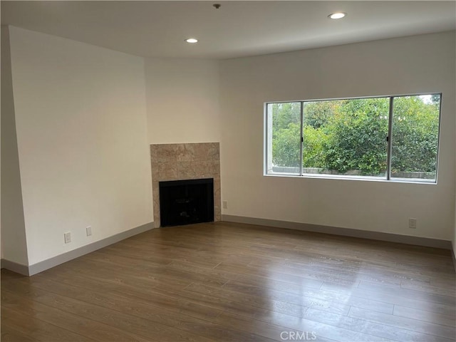 14914 Hamlin St Unit 105, Van Nuys, CA 91411 - unfurnished living room with a fireplace, wood finished floors, and recessed lighting