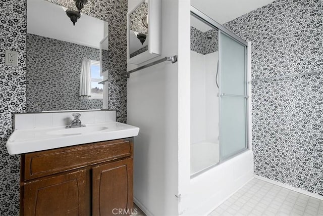 1851 Pacific Ave, Cayucos, CA 93430 - bathroom with wallpapered walls, vanity, and combined bath / shower with glass door
