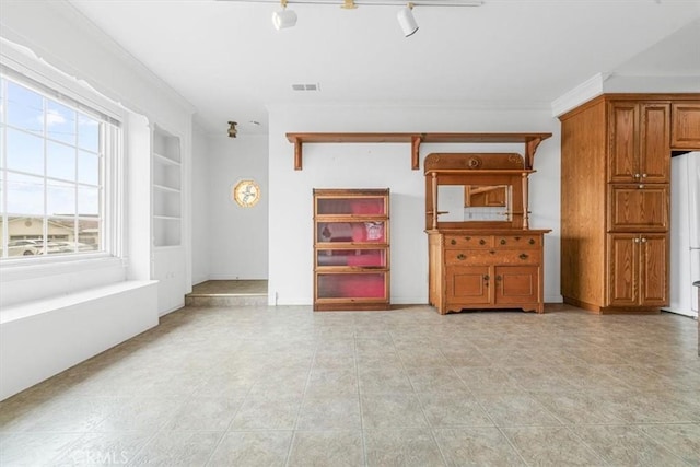 1851 Pacific Ave, Cayucos, CA 93430 - unfurnished living room featuring crown molding and light tile patterned floors
