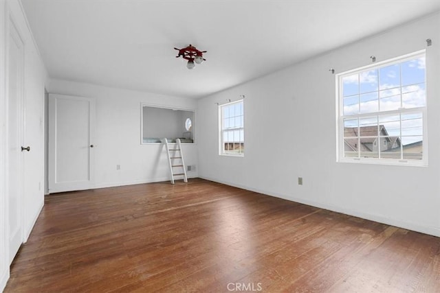 1851 Pacific Ave, Cayucos, CA 93430 - unfurnished living room with wood finished floors and baseboards