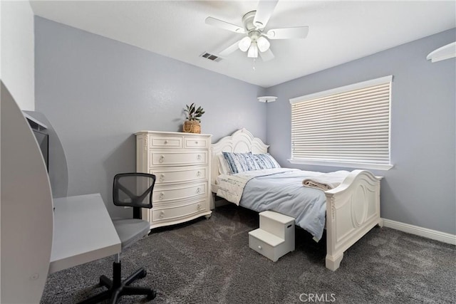 3312 Poplar St, Rosamond, CA 93560 - bedroom featuring dark carpet, a ceiling fan, and an office area