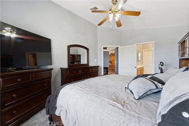 3312 Poplar St, Rosamond, CA 93560 - carpeted bedroom with vaulted ceiling, ceiling fan, and ensuite bathroom