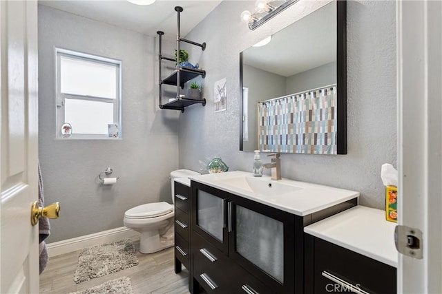 3312 Poplar St, Rosamond, CA 93560 - bathroom with vanity, wood finished floors, and a textured wall