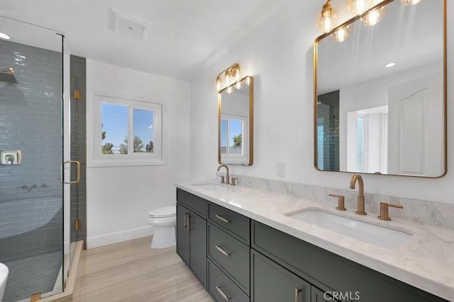 9500 Texhoma Ave, Northridge, CA 91325 - full bathroom featuring double vanity, a stall shower, wood finished floors, and recessed lighting