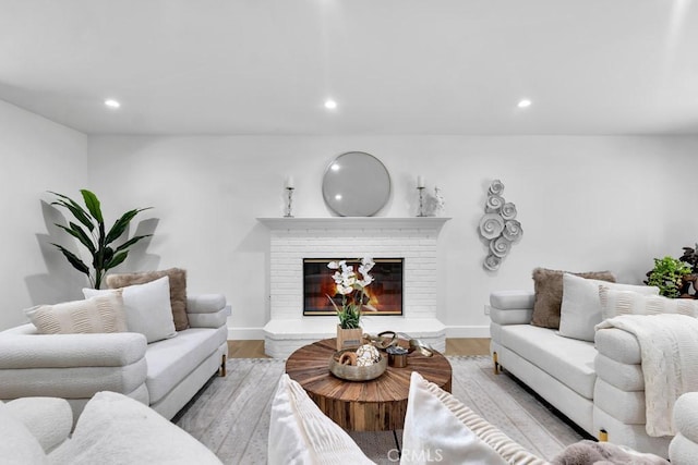 9500 Texhoma Ave, Northridge, CA 91325 - living area featuring wood finished floors, recessed lighting, and a brick fireplace