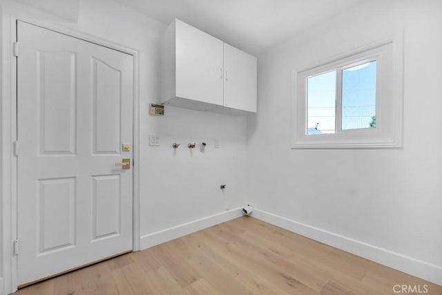 9500 Texhoma Ave, Northridge, CA 91325 - washroom with cabinet space, light wood finished floors, and hookup for a washing machine