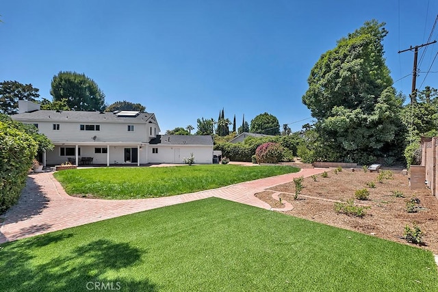 9500 Texhoma Ave, Northridge, CA 91325 - view of grassy yard with a patio area