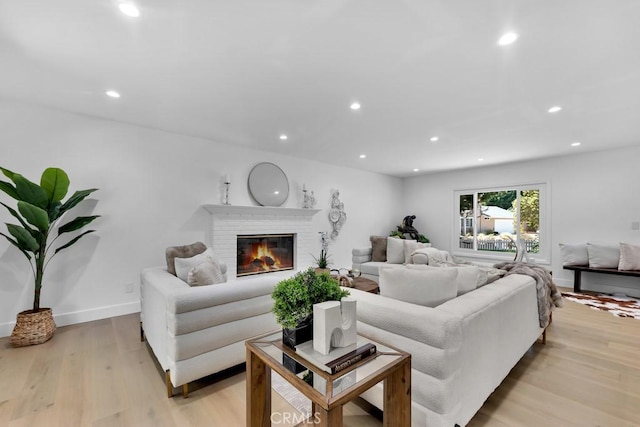 9500 Texhoma Ave, Northridge, CA 91325 - living room with recessed lighting, light wood-type flooring, and a fireplace