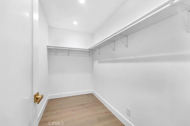 9500 Texhoma Ave, Northridge, CA 91325 - walk in closet featuring light wood-style flooring