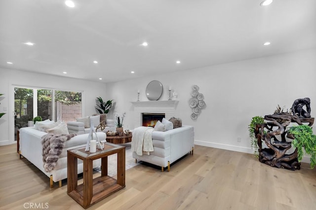 9500 Texhoma Ave, Northridge, CA 91325 - living area with light wood finished floors, a fireplace, and recessed lighting