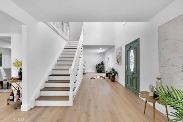 9500 Texhoma Ave, Northridge, CA 91325 - foyer featuring light wood finished floors, stairs, and a towering ceiling